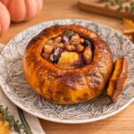 Roasted stuffed pumpkin with minced meat, beans and chestnuts