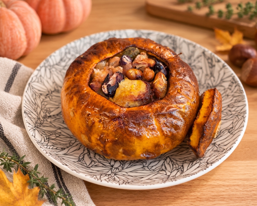 Roasted stuffed pumpkin with minced meat, beans and chestnuts